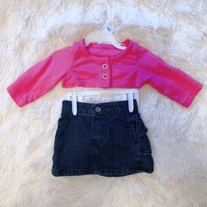 Infant mini skirt and pink top.